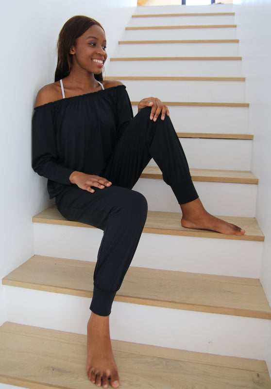 Lady Happily Sitting On The Stairs Wearing Comfortable Casualwear